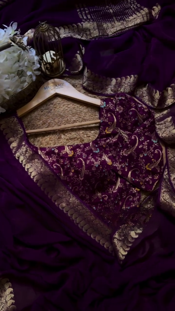 A pure chinnon purple jacquard and embroidery saree is a stunning choice for traditional and festive occasions